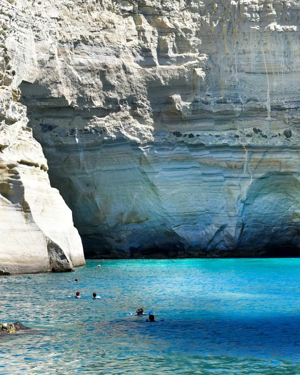People swimming in Kleftiko Bay, Greece