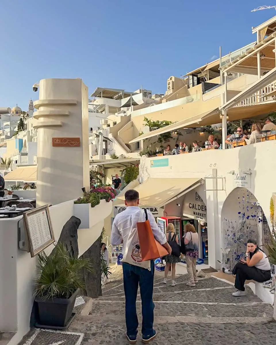 People walking down the street in Santorini, Greece