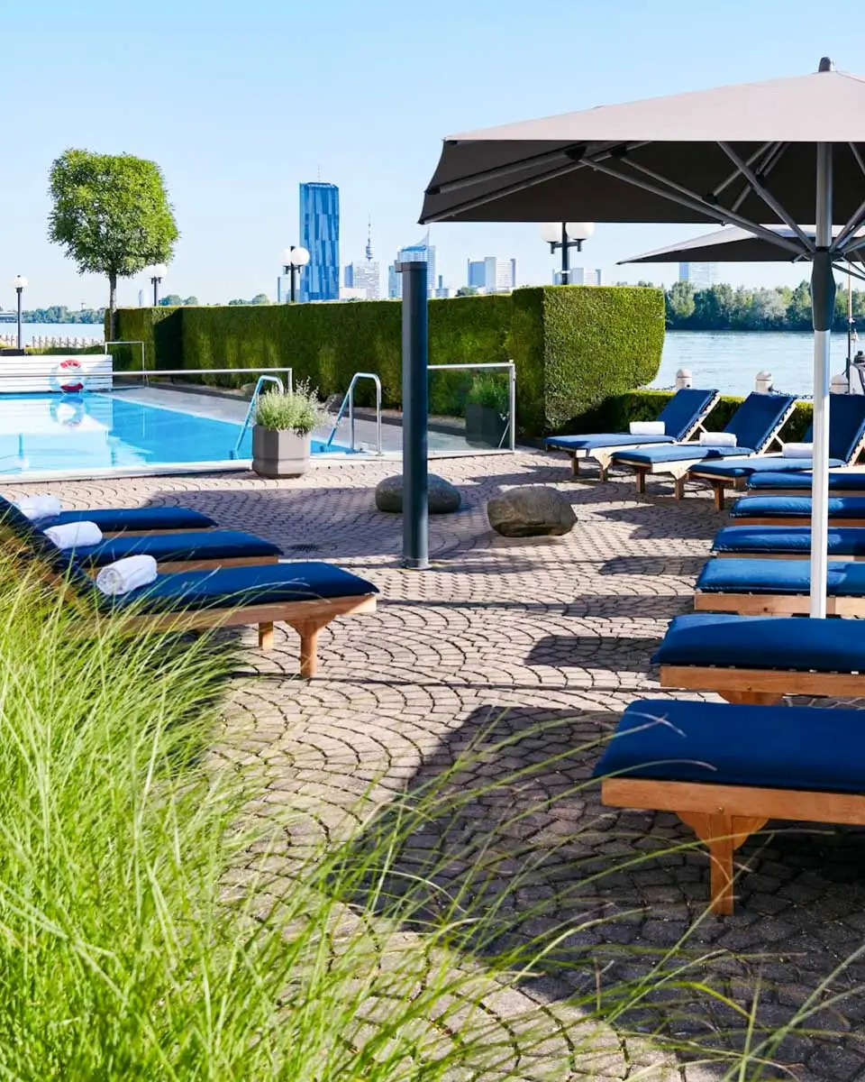 Pool and sunbeds at Hilton Vienna Waterfront