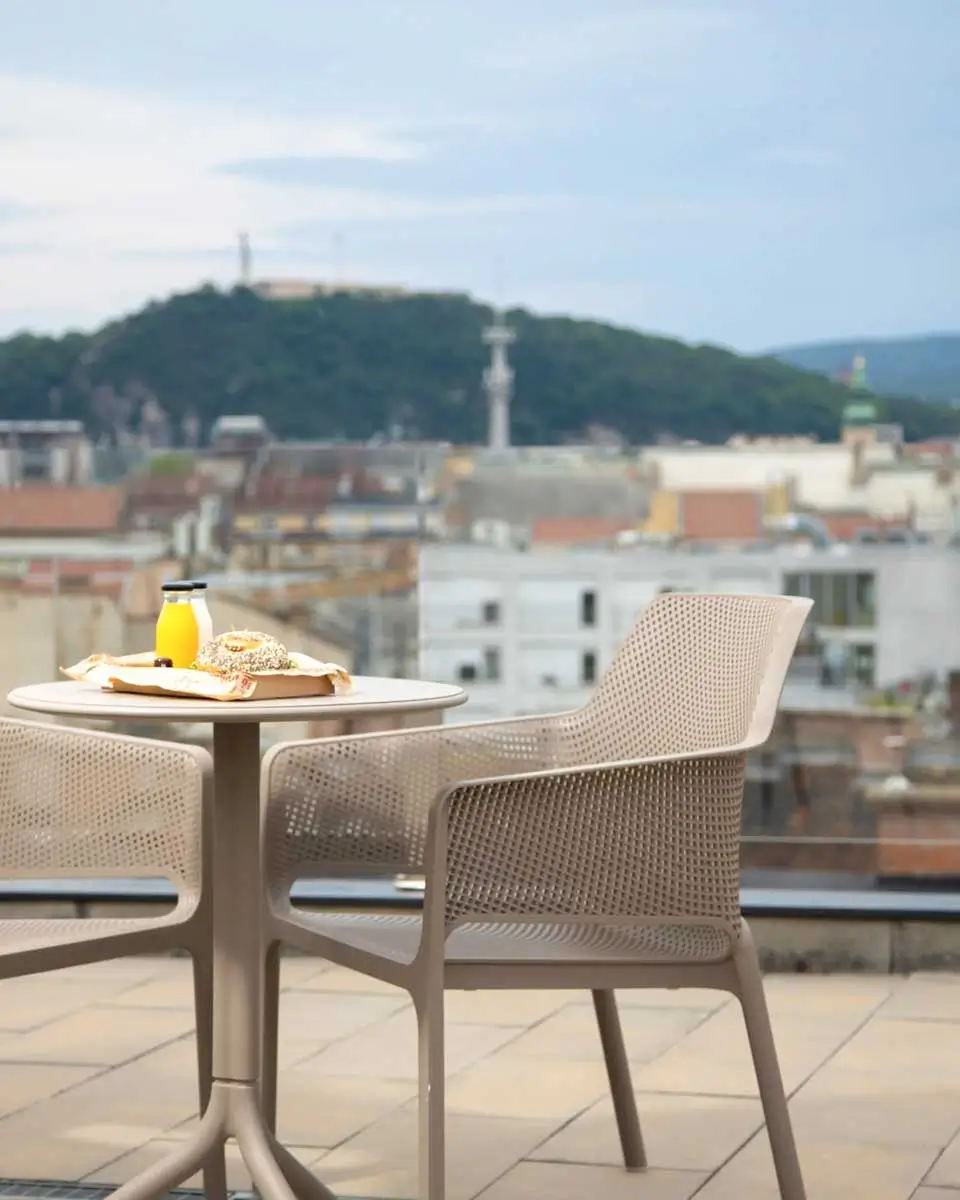 Seating at rooftop of The Amberlyn Suite Hotel
