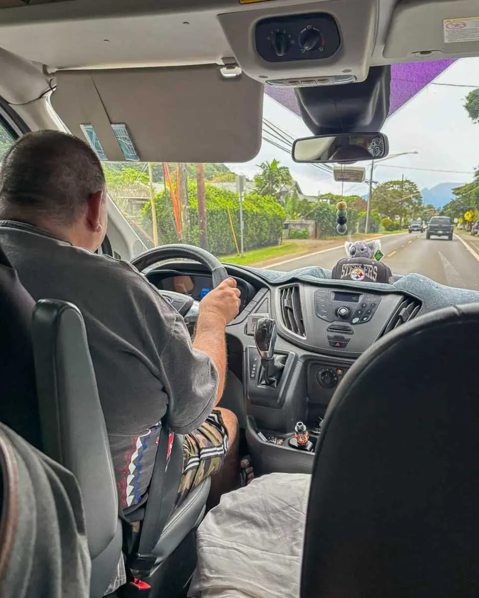 Shuttle driver taking passengers to a Luau in Hawaii