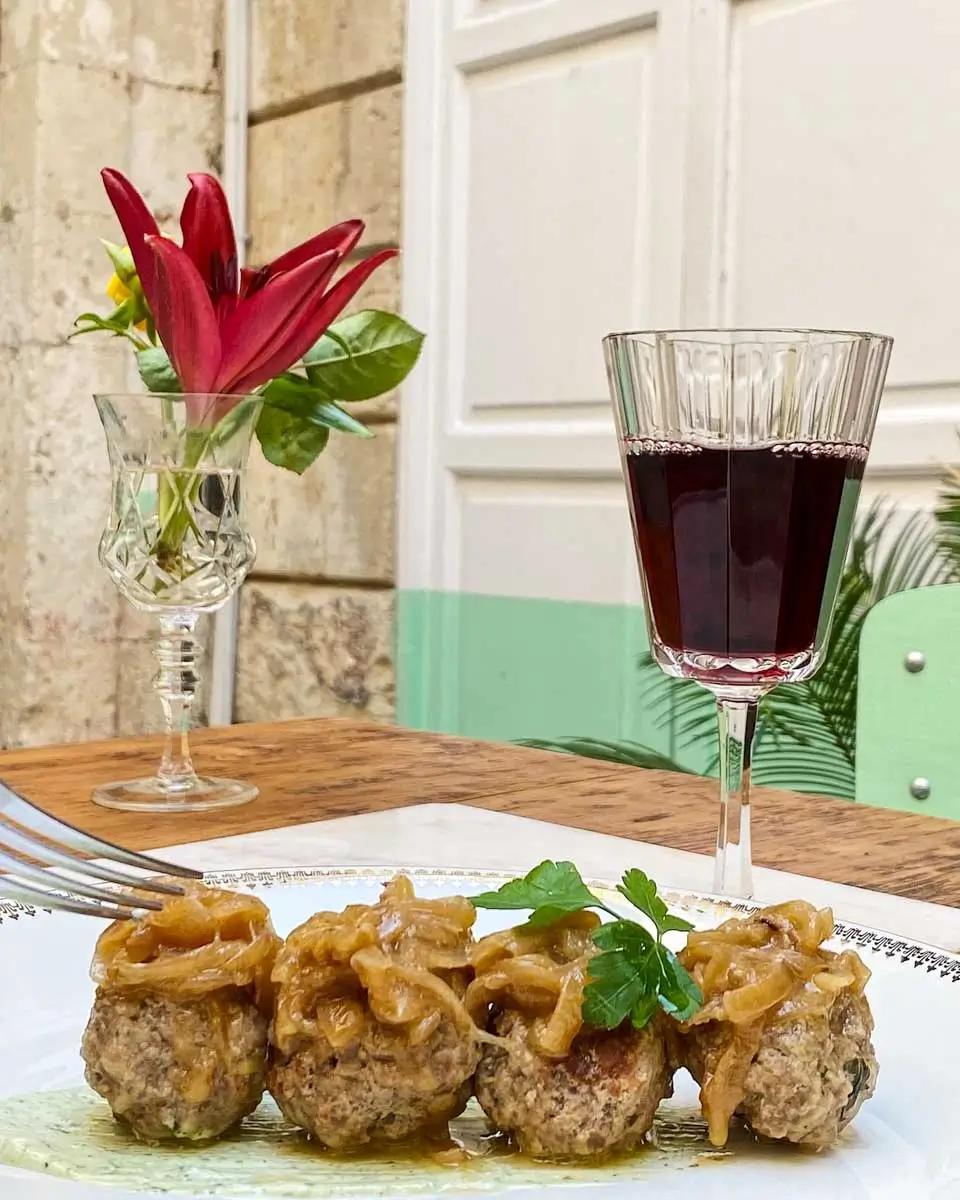Smoked meatballs with drink served at Chiodo - Ristorante Ortigia, in Syracuse Italy