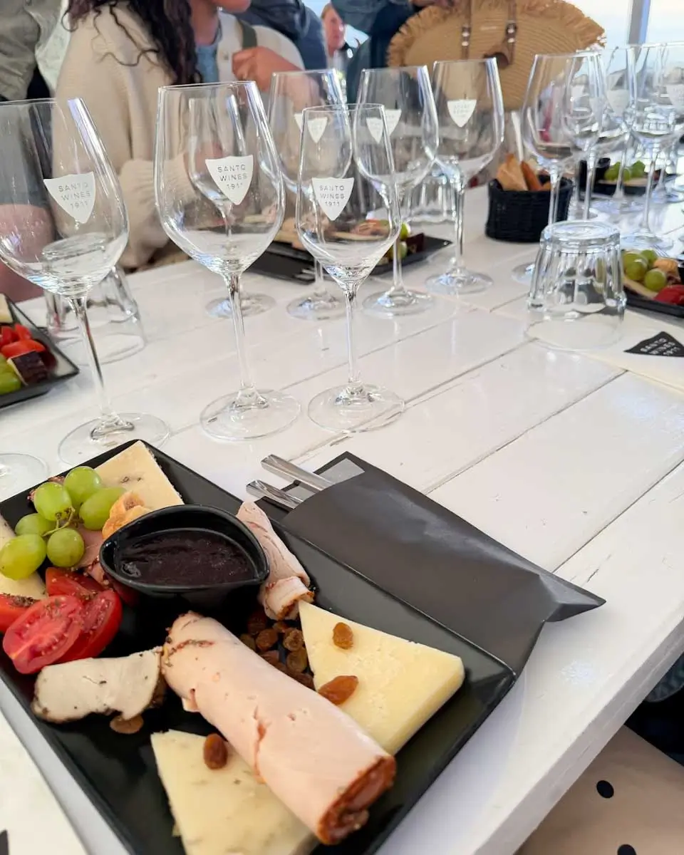 Snacks served with wines on a wine tour in Santorini, Greece