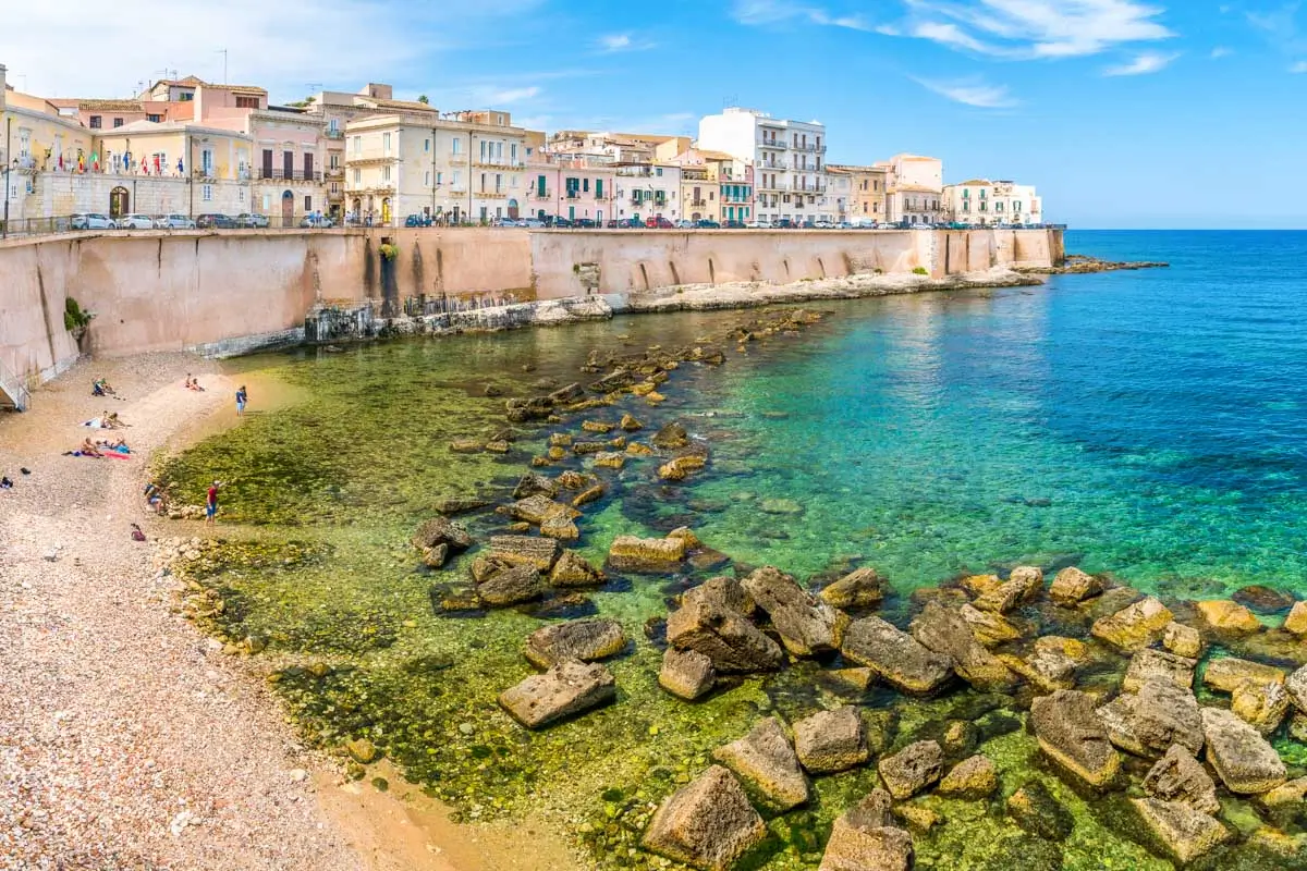 Syracuse waterfront in Ortigia on a sunny summer day. Sicily, southern Italy