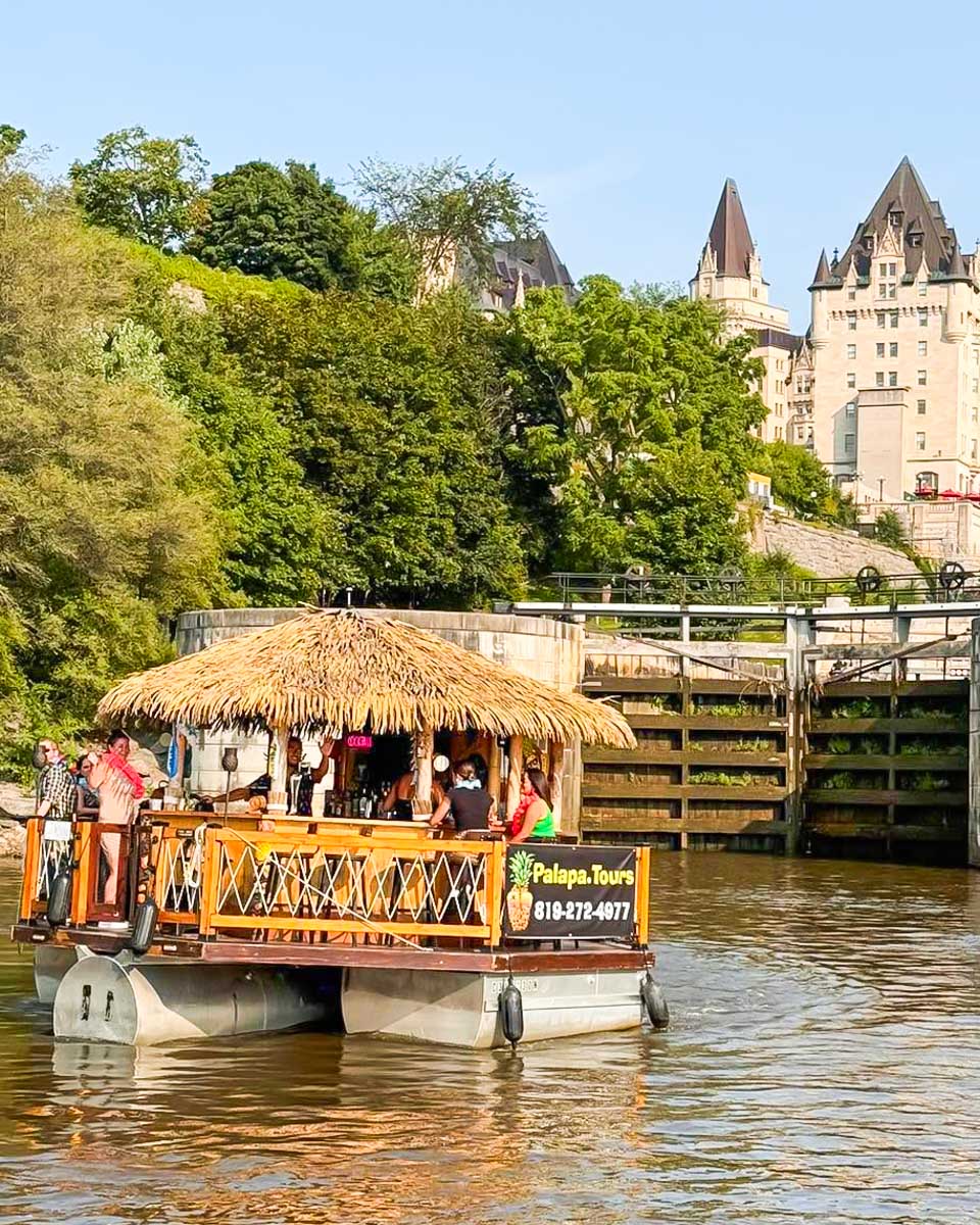 The Ottawa Palapa Tours tiki raft floating in the river