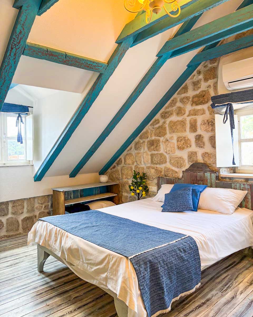 The bed in the hotel room at Rustico Guesthouse in Dubrovnik