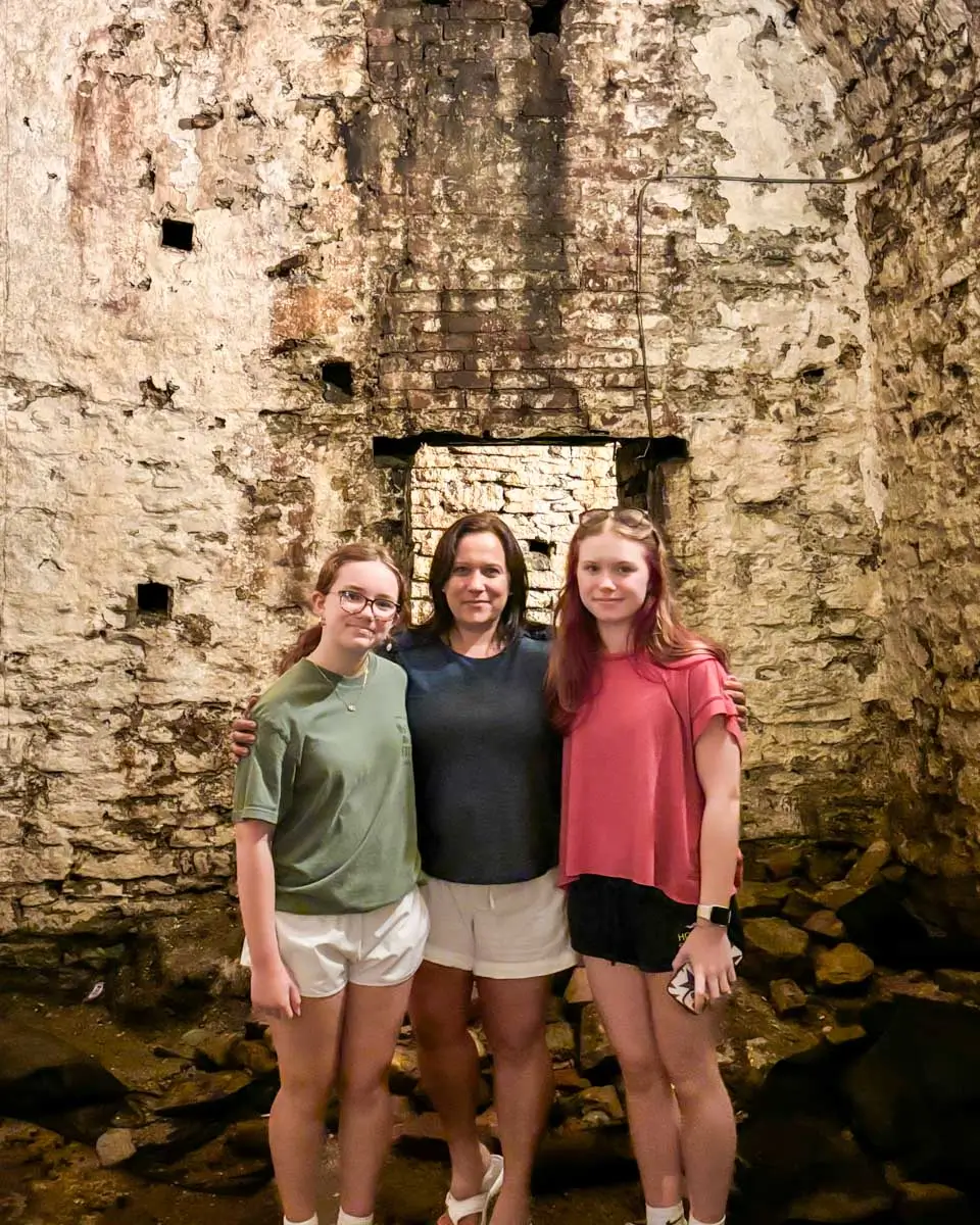 Theresa and family posing for a photo at the underground beer tunnels - Ultimate Queen City Underground Tour - Cincinnati