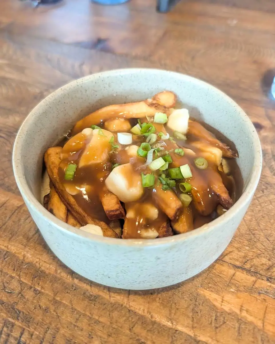 Traditional poutine eaten on a food tour in Montreal, Quebec