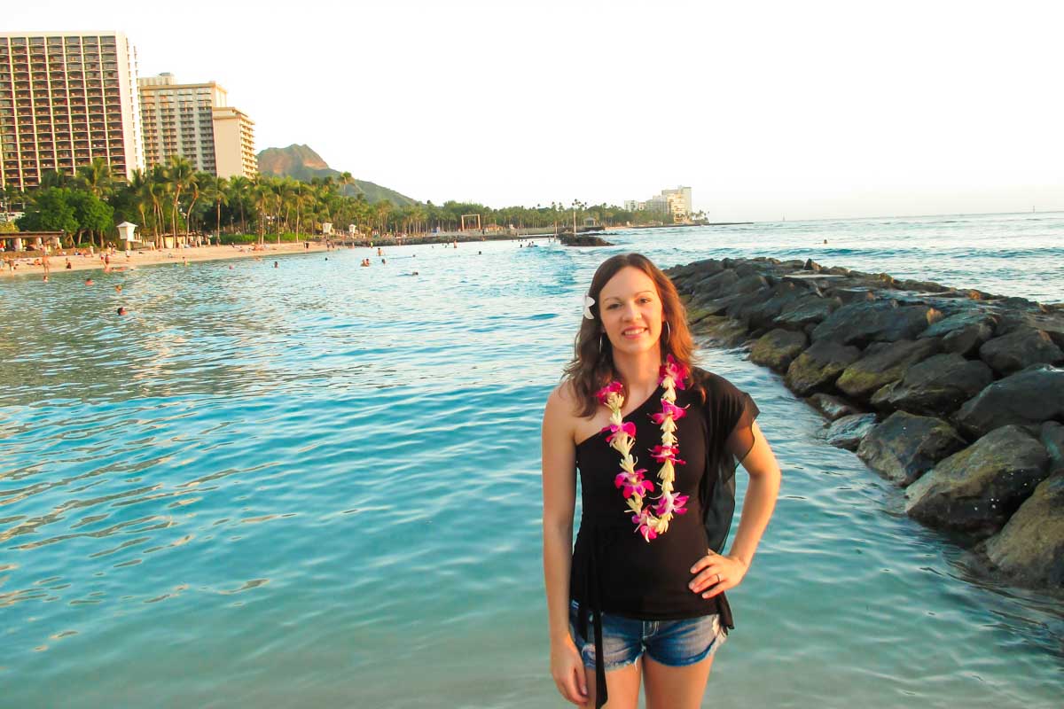 Trelle poses on thre beach in Honolulu, Hawaii