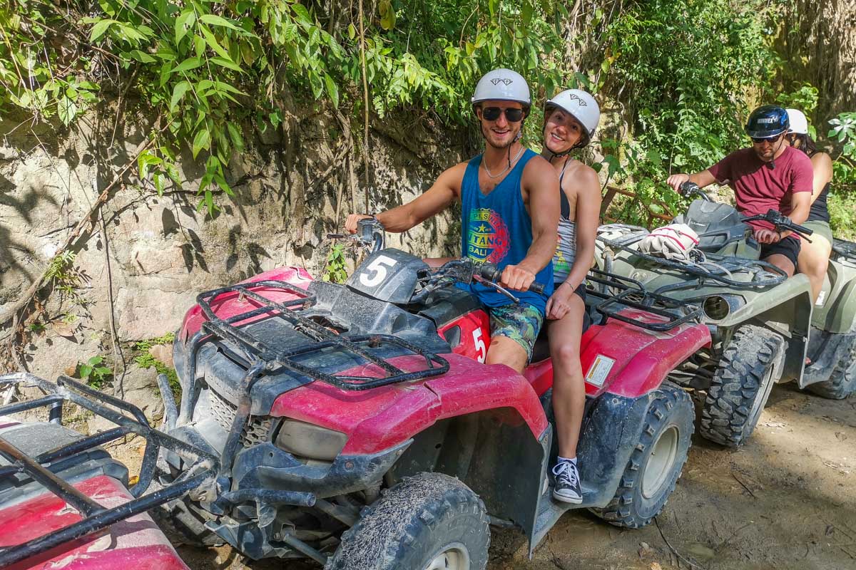 Two-people-sit-on-an-ATV-ready-to-start-the-tour-in-Sao-Miguel-Portugal