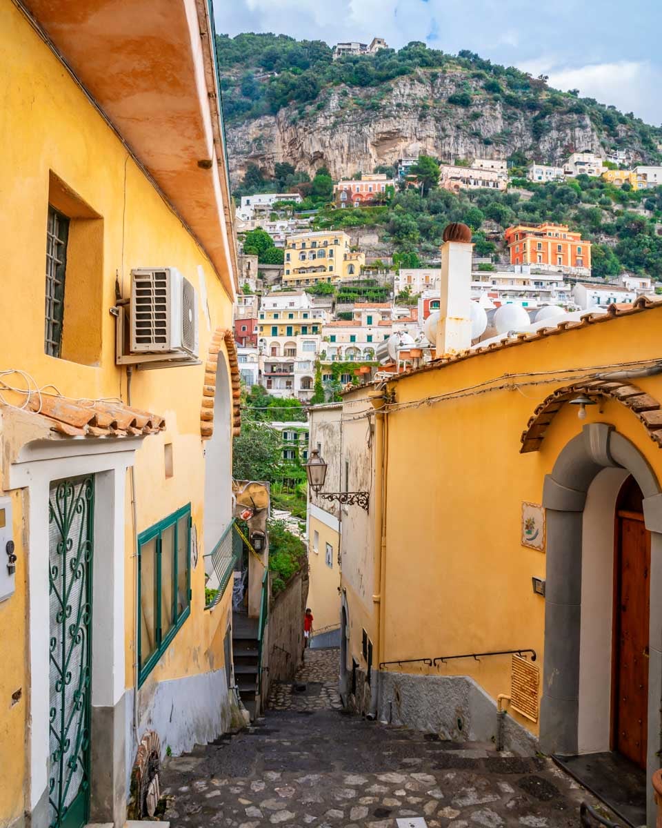 Typical narrow street and colorful houses in city of Positano, Amalfi coast, Italy