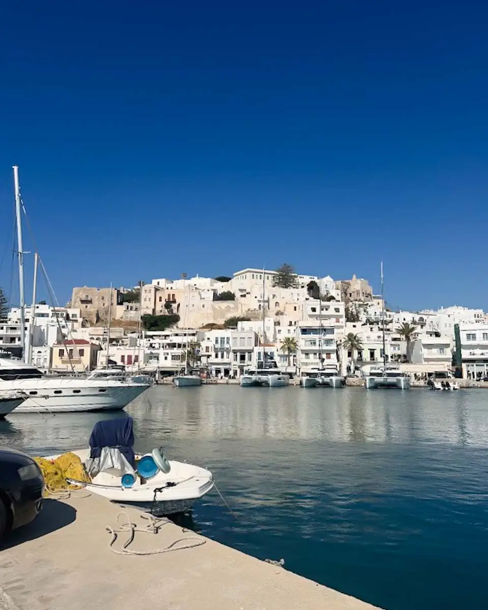 Waterfront view of Naxos Town with whitewashed buildings along the harbor