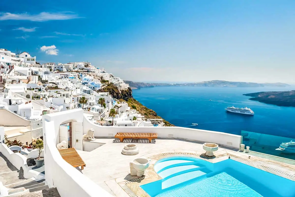 Whitewashed buildings and a rooftop pool seen in Santorini Island, Greece