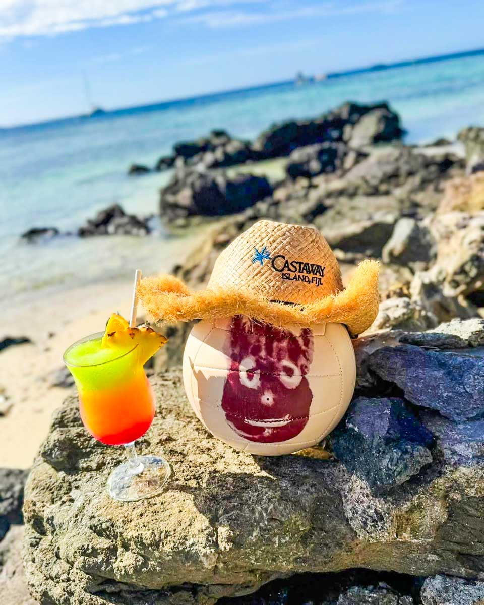 Wilson the volleyball with a drink at Castaway Island Resort in Fiji