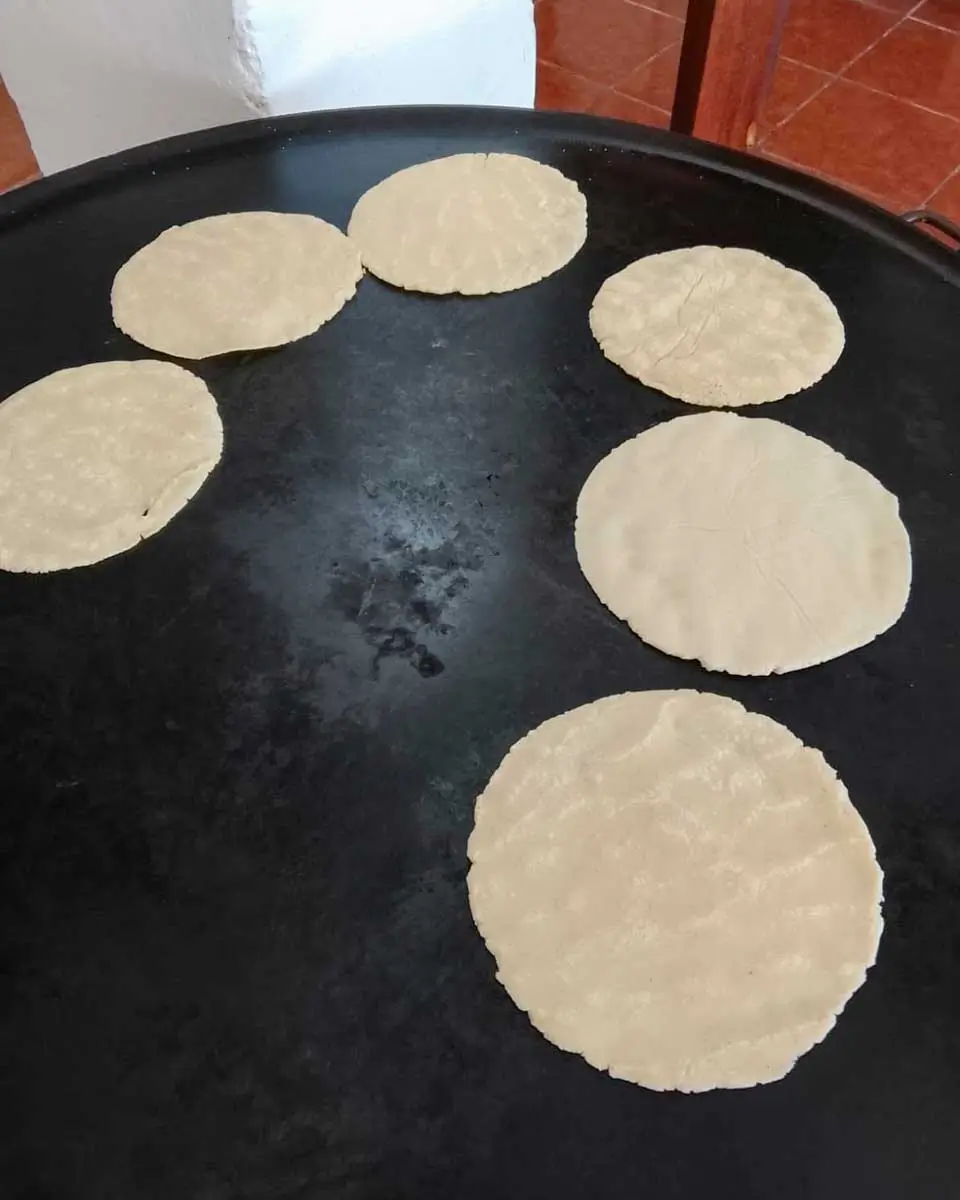 making tacos during cooking class in Costa Maya