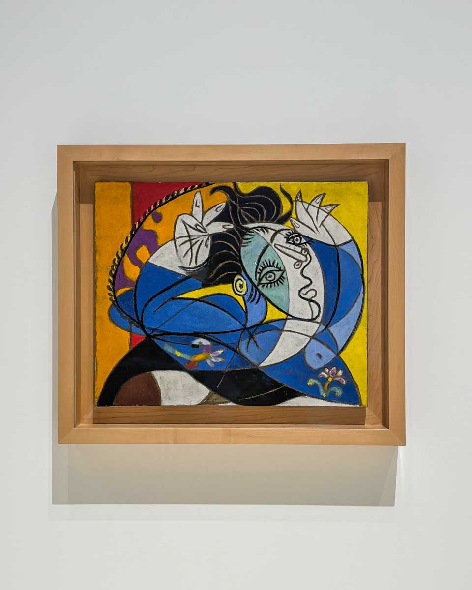 A Picasso painting hanging on the wall in the Picasso Museum un Malaga