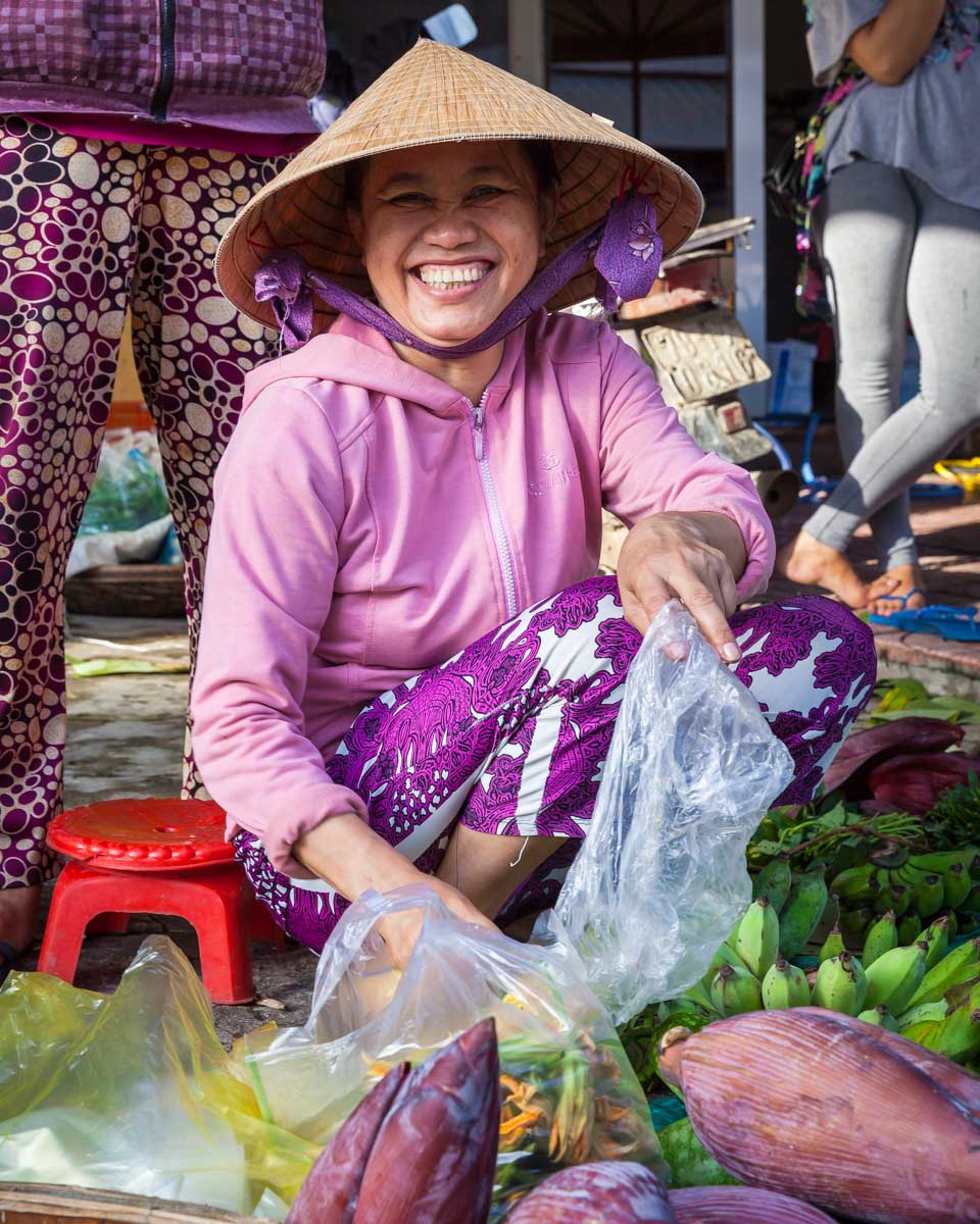 A-Vietnamese-woman-smiles-at the Nha Trang Night Market-Vietnam