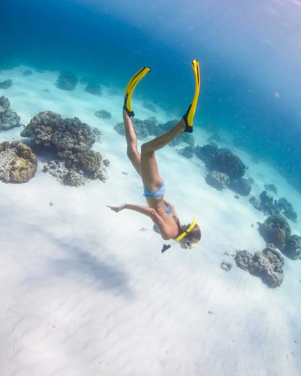 A woman snorkels at Haad Yao beach in Koh Phangan, Thailand