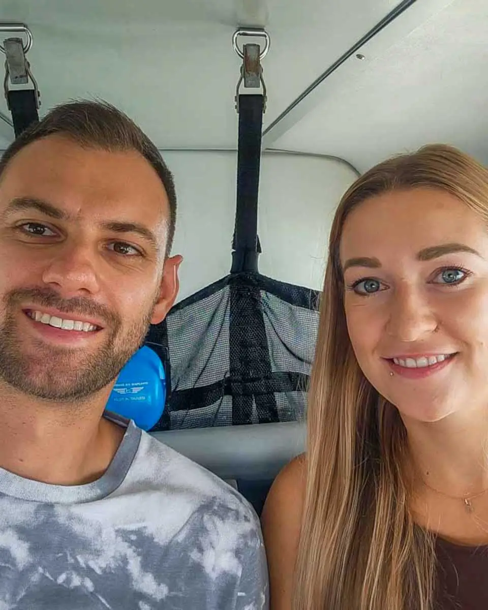 Bailey and Daniel take a selfie on a plane tour from Airlie Australia