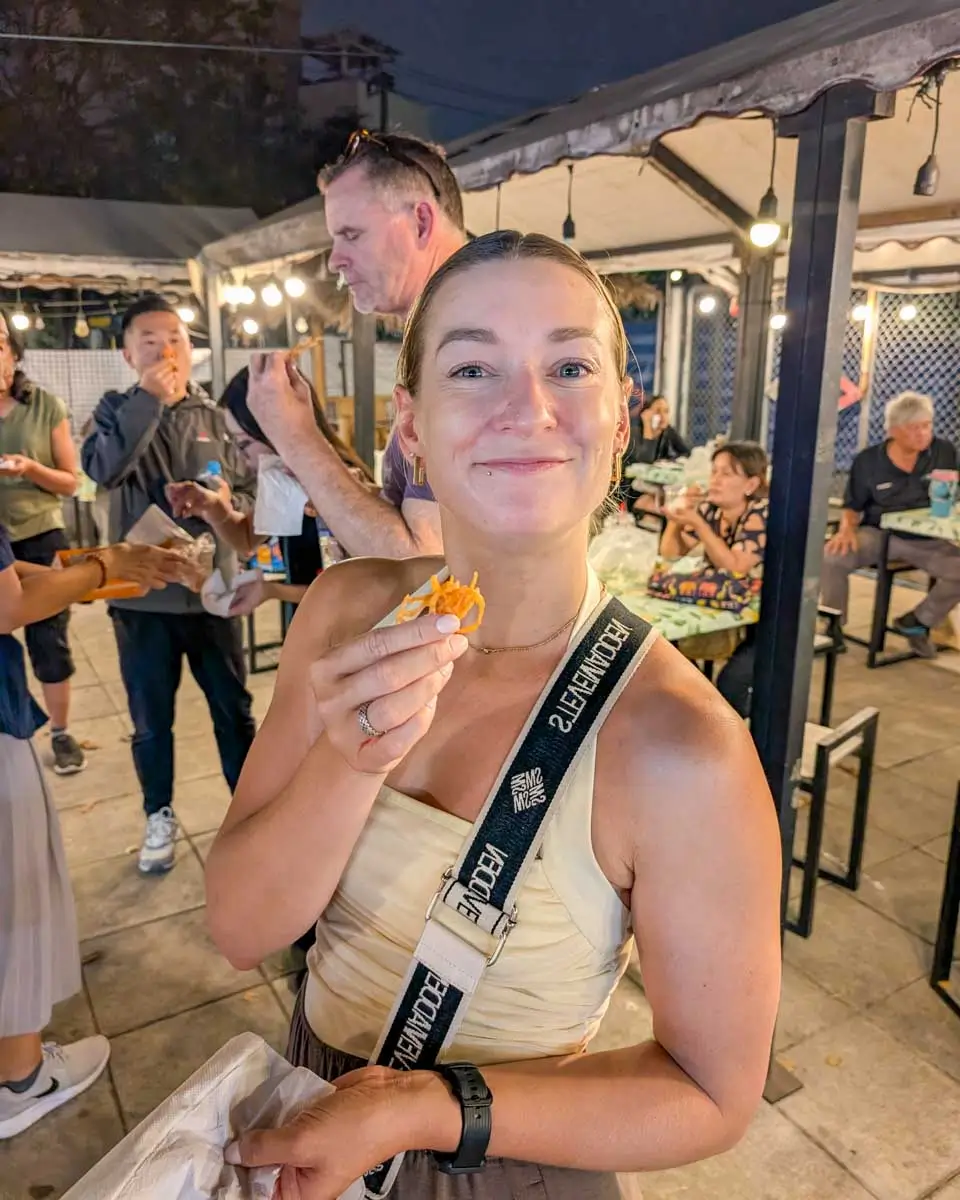 Bailey eats food at the Night Bazaar in Chiang Rai, Thailand