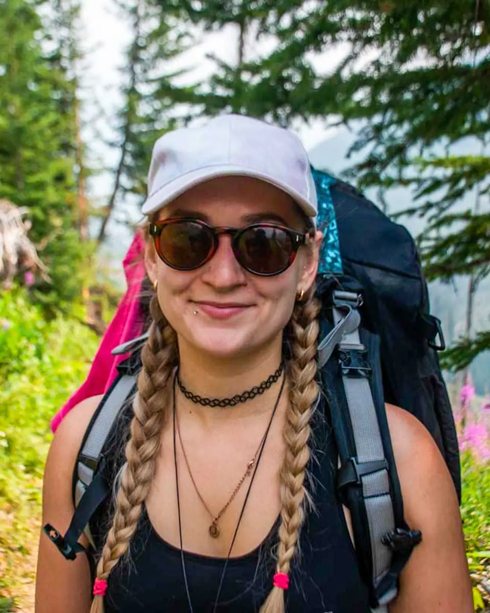 Bailey posing for a photo while hiking in Moorea, French Polynesia