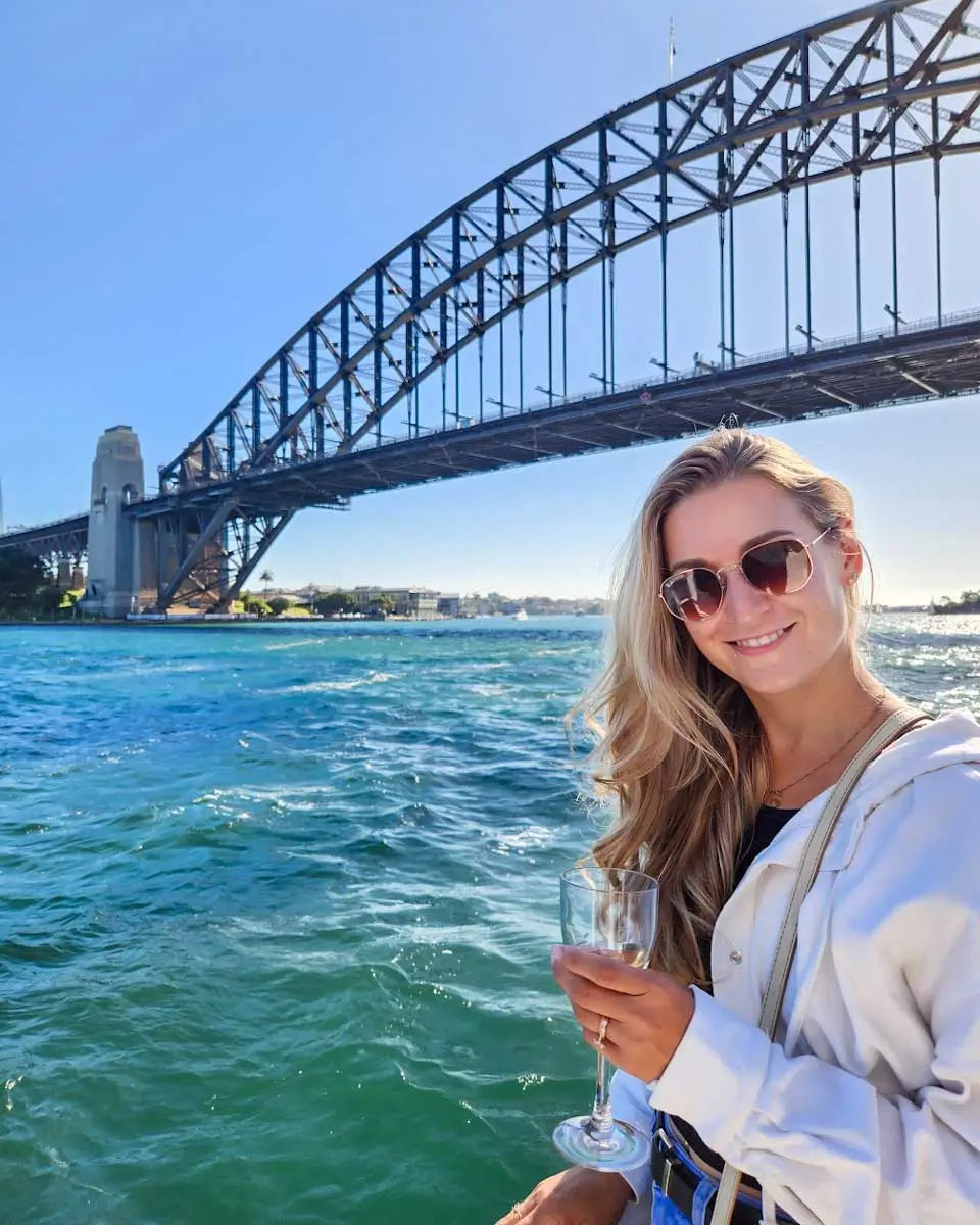 Bailey taking a photo on a Sydney Harbour Cruise