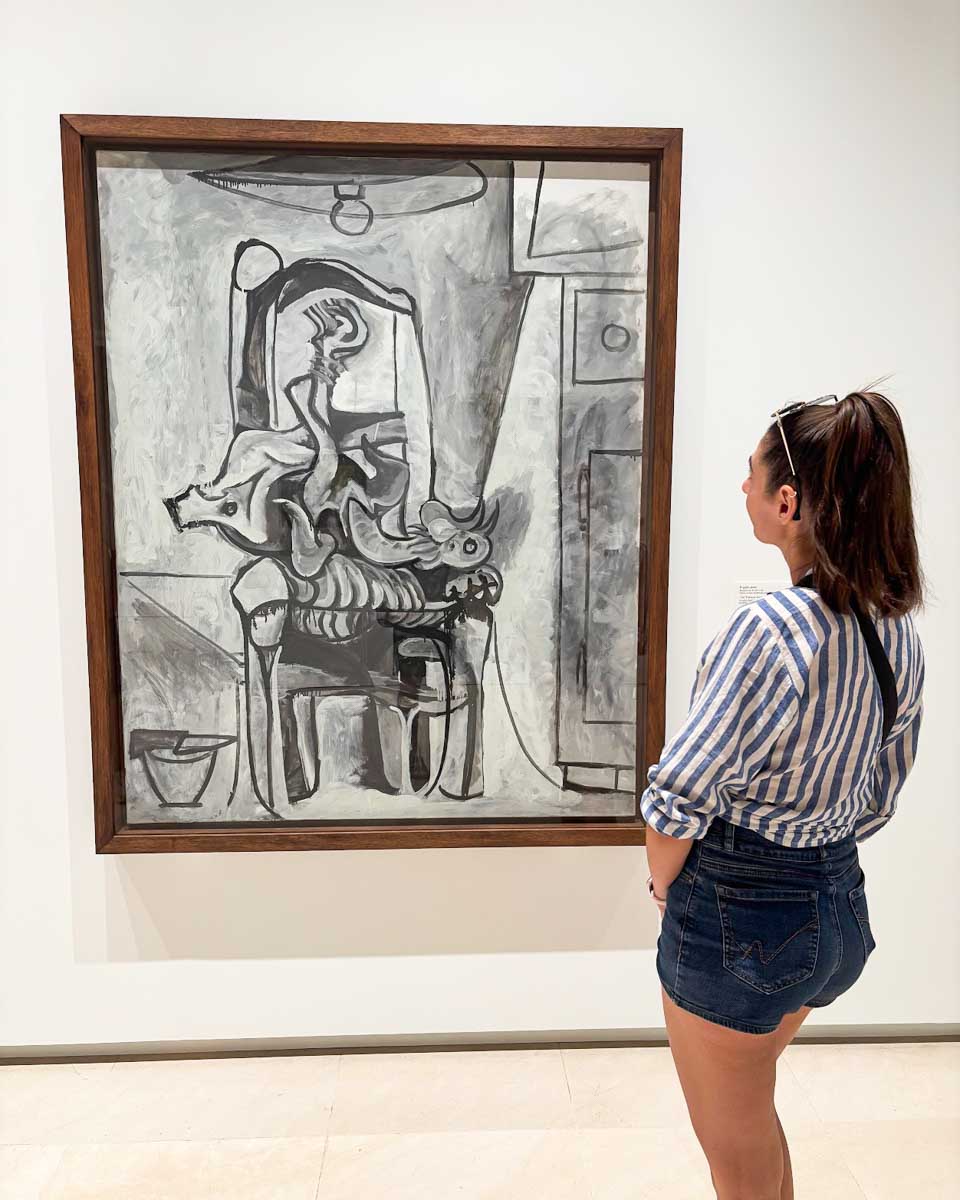 Brittni admires a painting at the Picasso Museum in Malaga