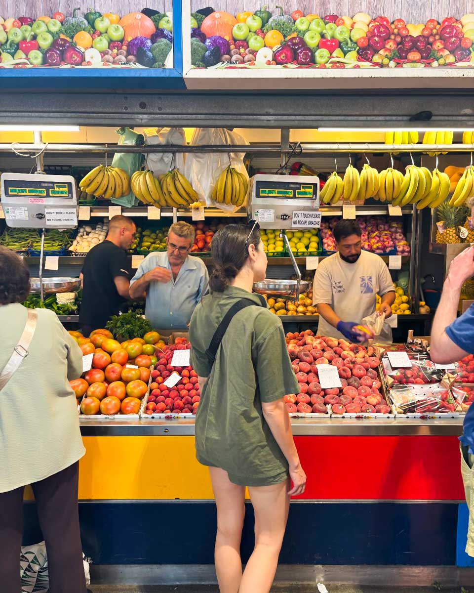 Brittni buys some fruit at Mercado Central de Atarazanas in Malaga