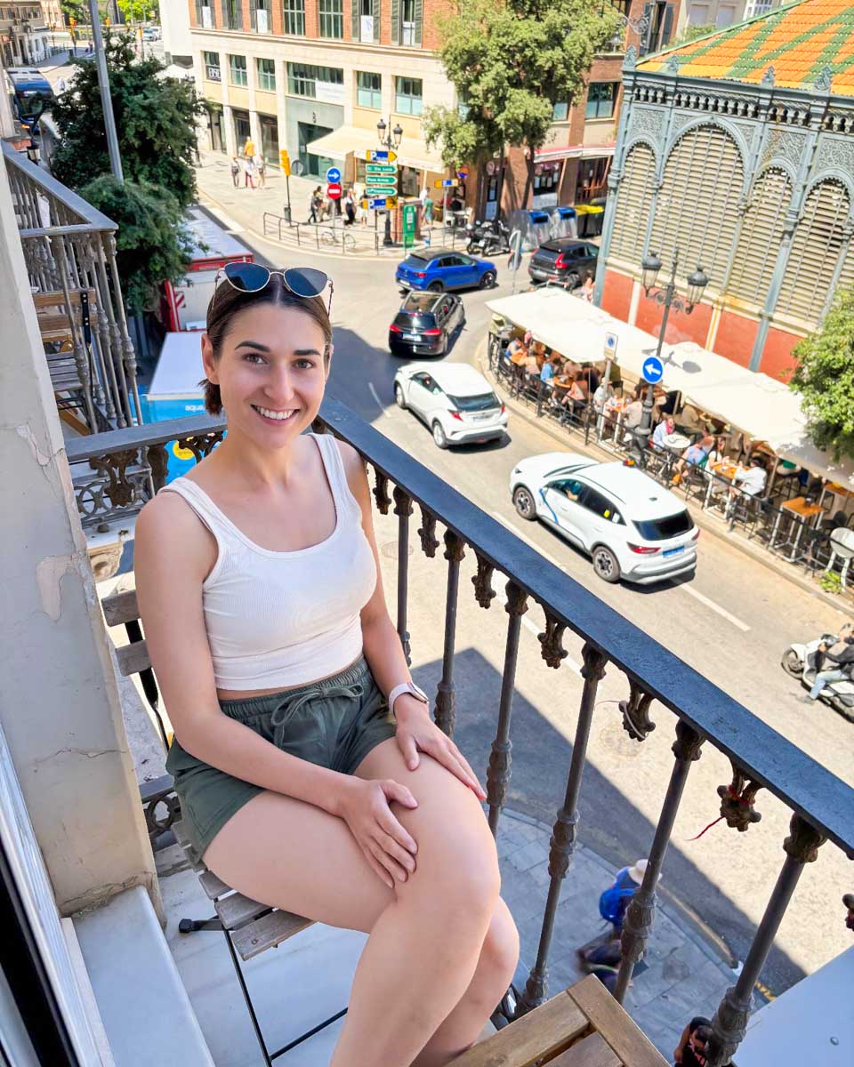 Brittni relaxes on the balcony of her room at the Lights City Rooms in Malaga