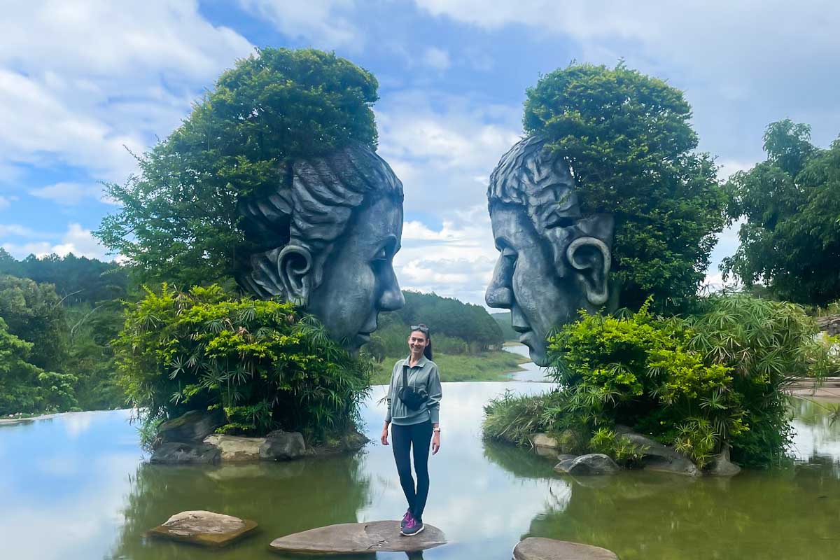 Brittni takes a photo with an art exhibit at the Clay Sculpture Tunnel in Dalat, Vietnam