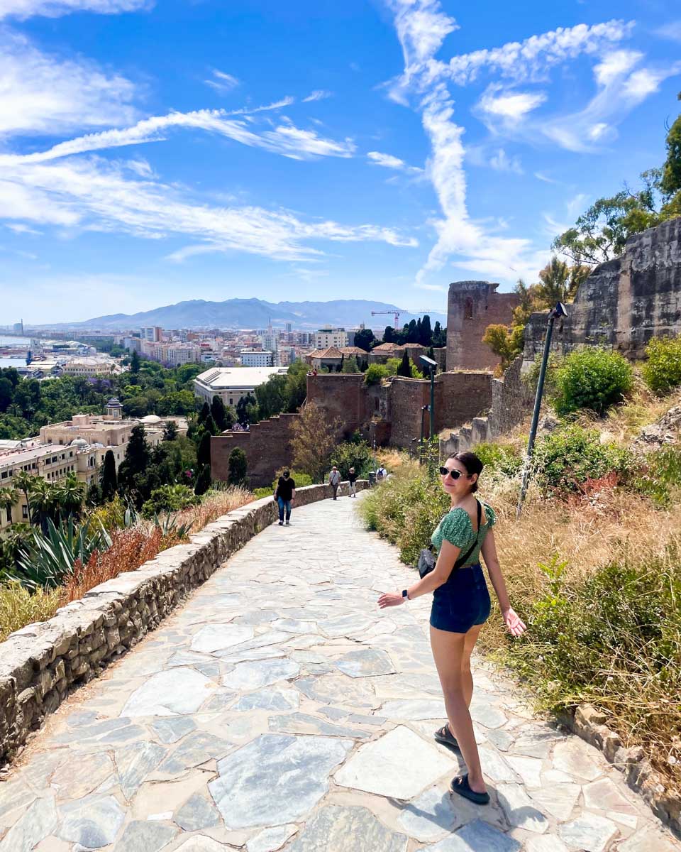 Brittni walks down the path to Gibralfaro castle in Malaga