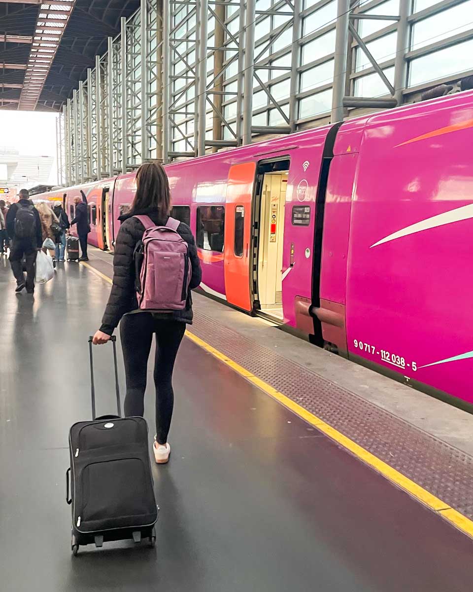 Brittni walks to her train at the Seville train station in spain