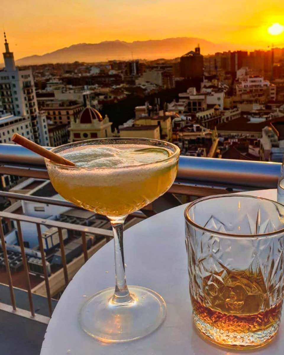Cocktails at the rooftop bar during sunset at AC Hotel Málaga Palacio in Malaga