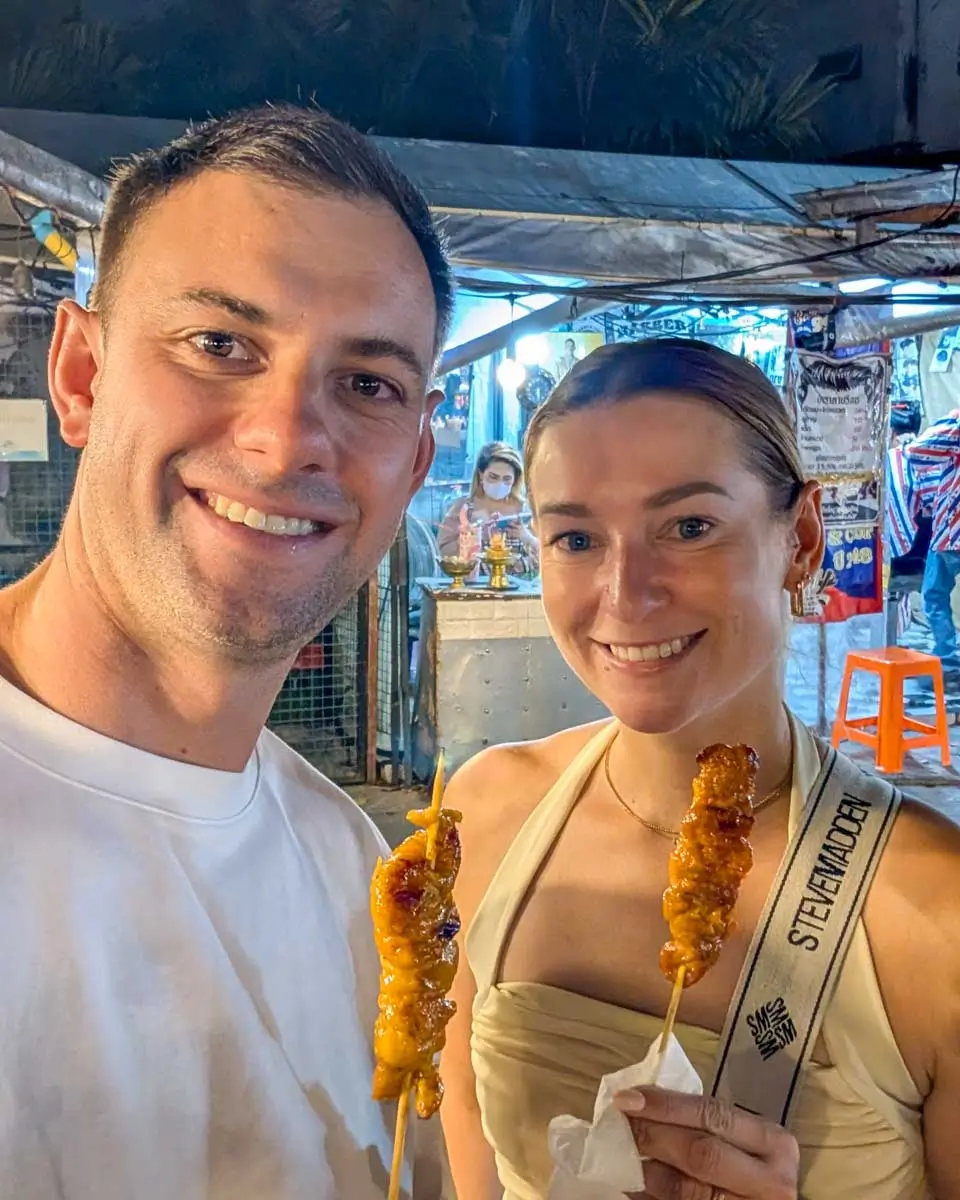 Daniel and Bailey eat food at the Night Bazaar in Chiang Rai, Thailand