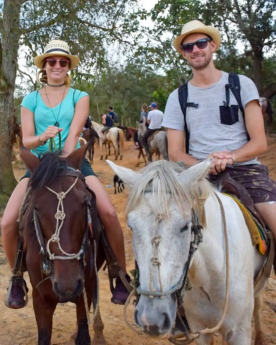 Daniel and Bailey riding horses in Hondarus