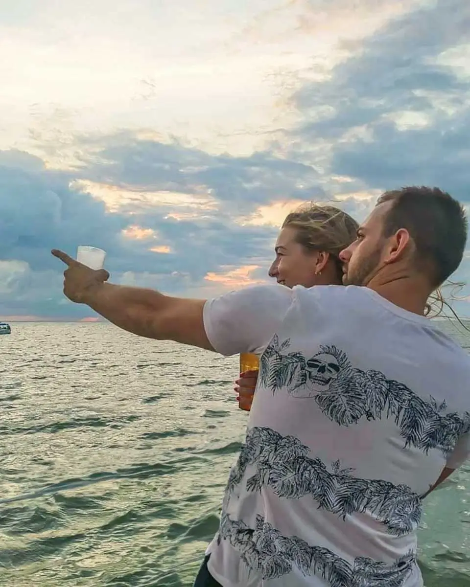 Daniel-points-to-something-on-a-sunset-cruise-tour-in-Nha Trang, Vietnam