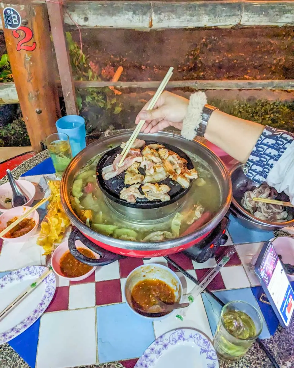Eating hot pot with locals in Pai, Thailand