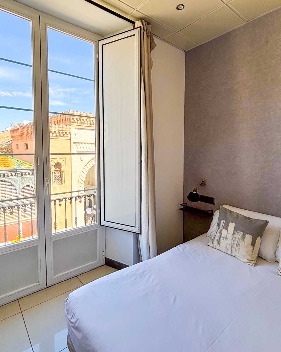 Hotel room with a view of the Market at the Lights City Rooms in Malaga
