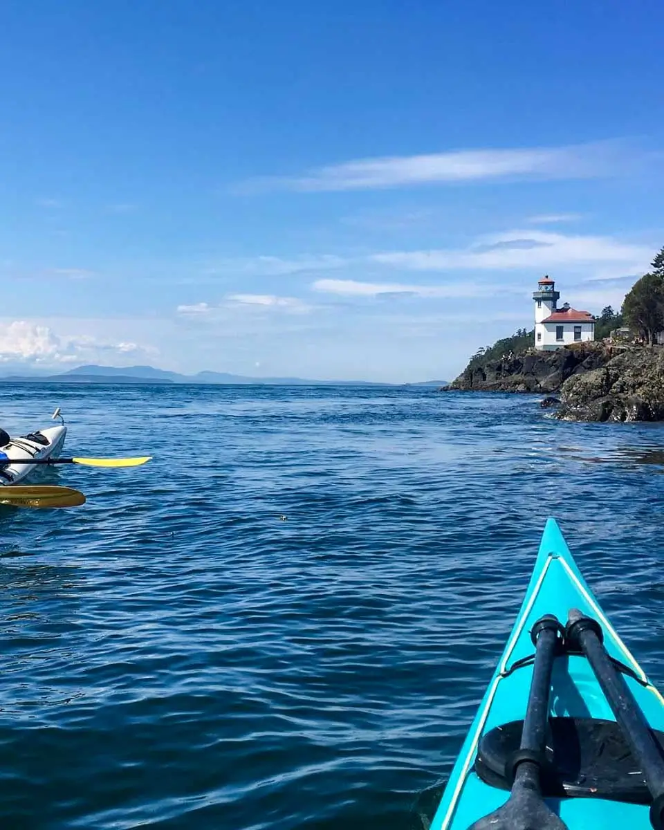 Lime Kiln Point Lighthouse seen on a kayak tour in San Juan Islands, Washington