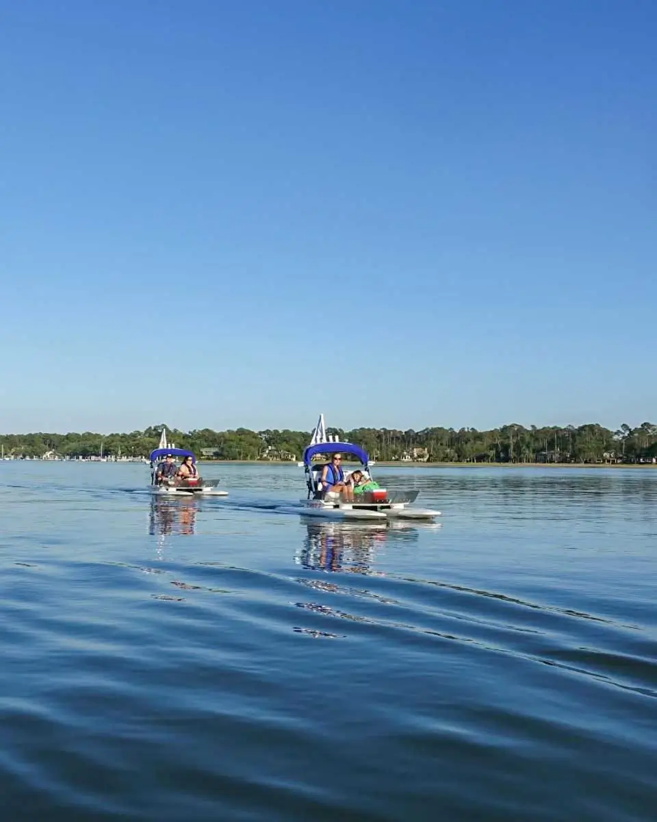 People riding cat boats in Hilton Head Island, USA