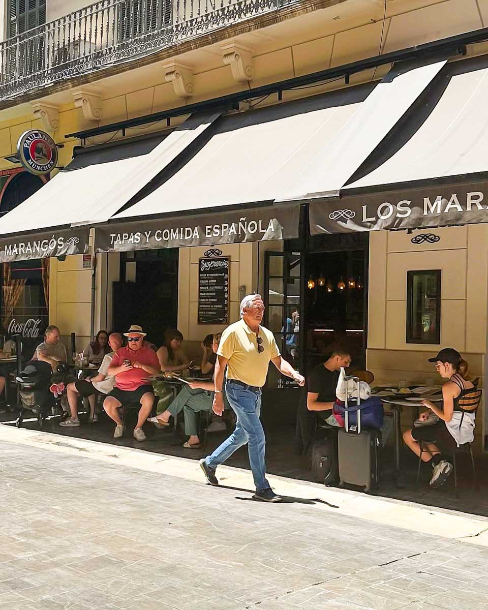 People sit on the outside terrace at Los Marangós Molina Lario in Malaga