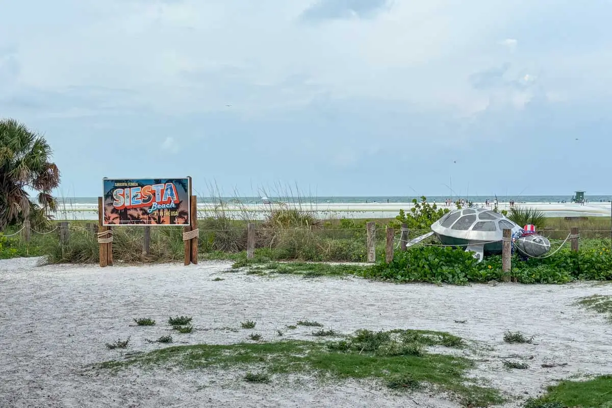 Siesta Beach sign and turtle in Siesta Key, Florida