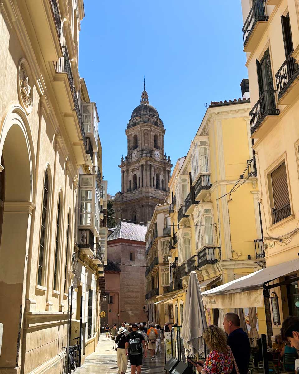 The cathedral seen on a street in the centro historico area of Malaga