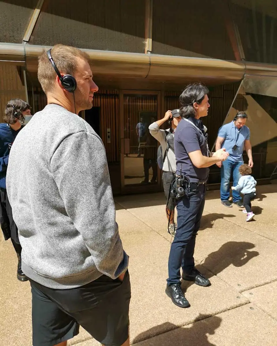 Tour guide explaining about the Sydney Opera House, Australia