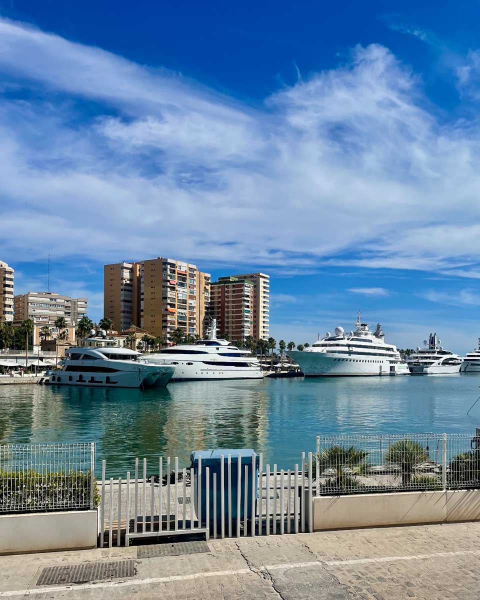 View of ships in the harbor seen from Palmeral de Las Sorpresas in Malaga