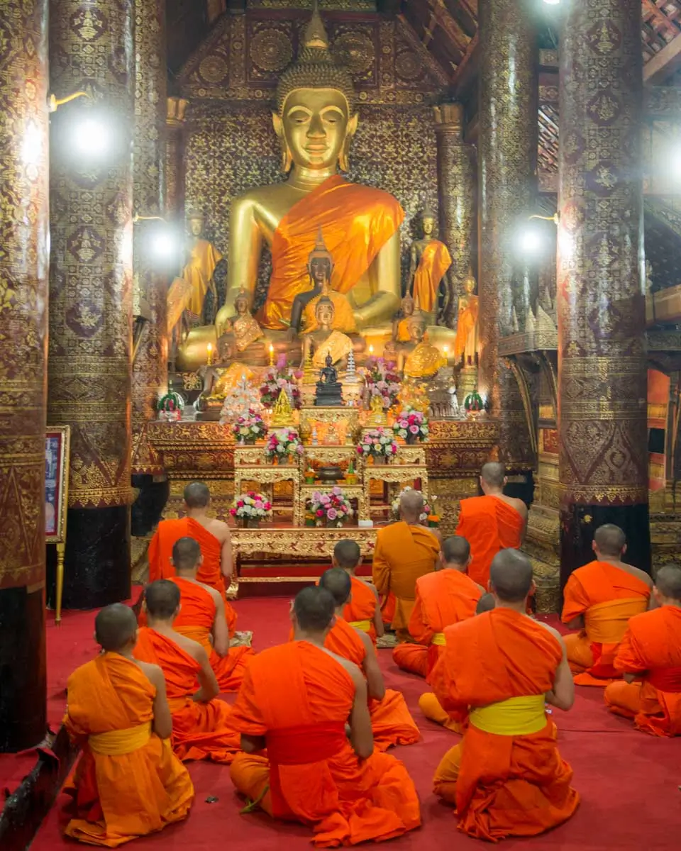 Wat xieng thong and monks in the town of Luang Prabang, Laos