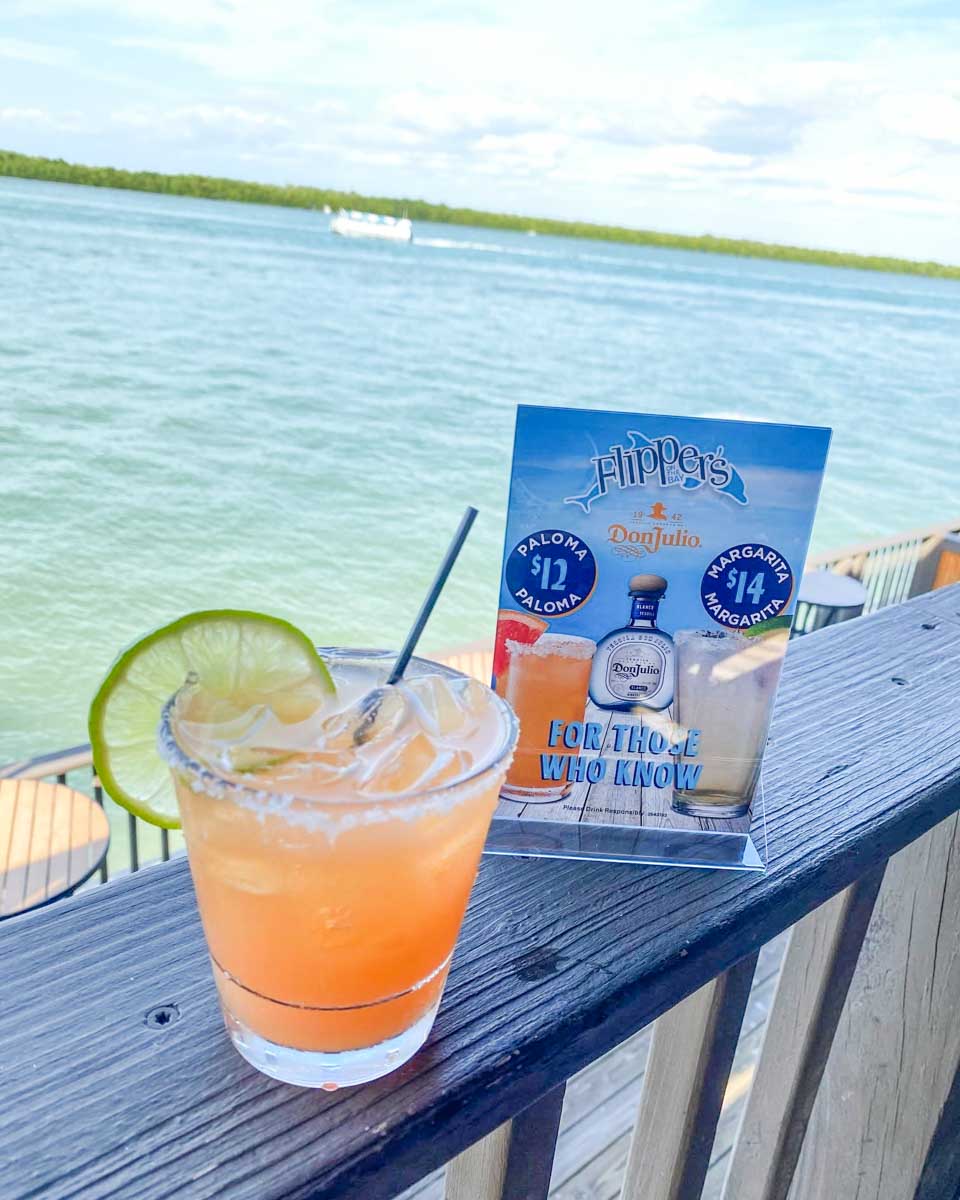 A cocktail drank by the water at Flippers On The Bay in Fort Myers