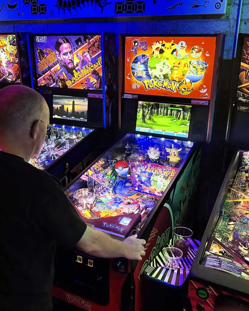 A man playing game at Cobra Arcade Bar, Tucson, Arizona