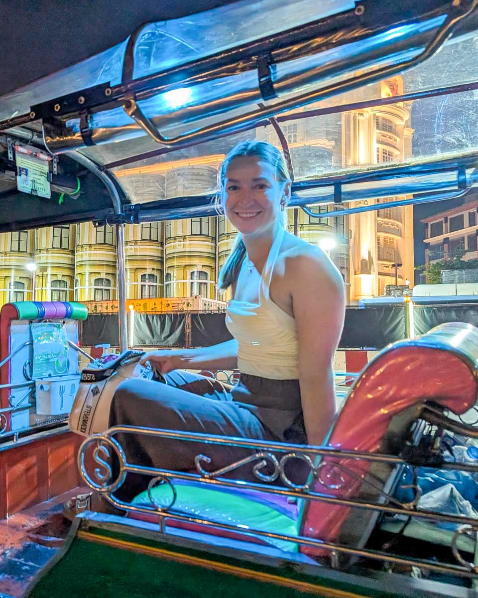 Bailey-sits-in-a-tuk-tuk-at-night-in-Vientiane-Laos