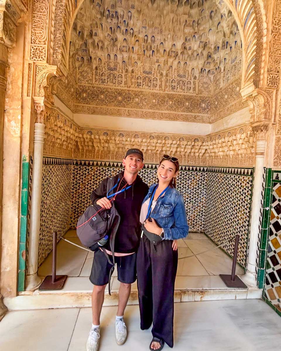 Brittni and Jesse smile in the Nasrid Palaces at the Alhambra